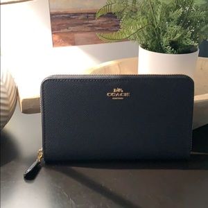 Coach Continental Zip Wallet in Midnight color.